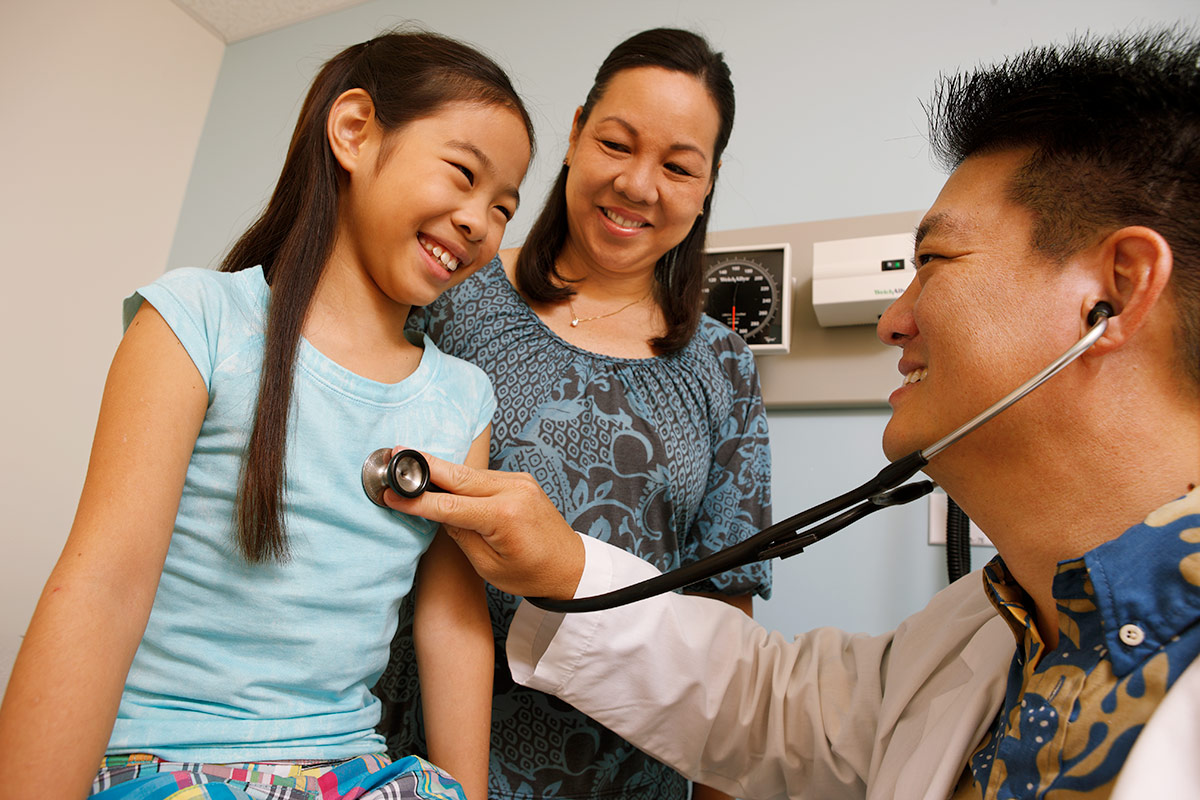 Kaiser Permanente Hawaii - Doctor with young girl and mother